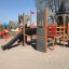 Playground castle structure with slides and towers - Camelot castle with slide.