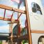 Wooden Camelot castle with slide for kids on playground