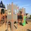 Camelot castle with slide playground structure
