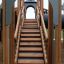 Wooden staircase of Camelot castle with slide on a playground.
