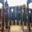 Wooden bridge and play structure of the Camelot castle with slide in a playground.