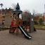 Tintagel playground castle with slide and climbing structure in a residential area playground.'