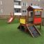 Hill Slide SL90 with a red slide and wooden playhouse in a playground