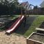 Outdoor Hill Slide SL150 in a playground.