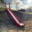 Hill Slide SL210 playground slide on a sunny day.
