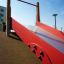 Red slide Hill Slide Wide SLW120 in a playground.