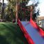Outdoor Hill Slide Wide SLW150 on a grassy hill.