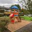 Logo Tower playhouse with slide in a playground