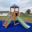 Logo Tower playhouse with slide on blue rubber safety surface
