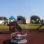 Playground with Logo Tower playhouse with slide.
