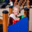 Child playing on the Nemo playground equipment.