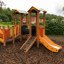 Smart playhouse with slide in a playground