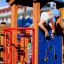 Child playing in a Smart playhouse with slide at a playground