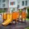 Rubik playhouse with slide in a residential playground