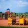 Rubik playhouse with slide in a playground.