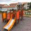 Rubik playhouse with slide on a playground.