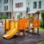 Rubik playhouse with slide in a residential playground