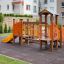 Rubik playhouse with slide in modern playground