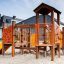 Rubik playhouse with slide in a playground