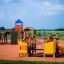 Rubik playhouse with slide in a playground.