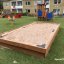 Sandpit in a playground located in front of residential buildings