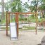 Wooden playground structure with slide and climbing net for children - Grocer's single slide.