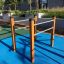 Parallel bar in outdoor gym on a sunny day.