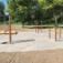 Outdoor fitness equipment for strength training named Training Twist placed in a park.