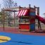 Little Jungle single slide playground equipment with climbing frame and spring rider on blue and yel