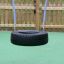Tire swing hanging from ropes.