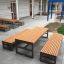 Outdoor furniture set Kyoto: wooden tables and benches with metal frames in a modern patio area.