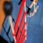 Red climbing ladder with ropes, part of Climbing Kiosk.