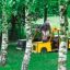 Wooden playground Taxi vehicle with child playing inside on green grass