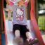 Child playing on Fire-station playhouse with slide.