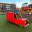 Red Fire brigade truck play equipment on playground.