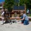 Children playing in the All accessible sandbox at the playground.