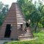 Children playing in a Wigwam wooden house.