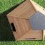 Wigwam wooden house on green grass seen from above.
