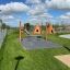Wigwam wooden house playground with swings and slide