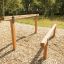 Outdoor exercise equipment 'Double Jump Bars' in a park setting.