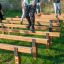Children playing on the Hip Hop outdoor balance beams in a park.