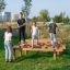 Children playing on the Hip Hop wooden playground equipment.