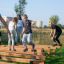 Children playing on Hip Hop playground equipment in a park.