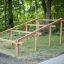 Wooden Climb Obstacle ladder in a park setting.