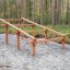 Climb Obstacle wooden ladder in forest playground area.