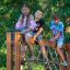 Children playing on V-shape Net Large climbing net on playground equipment