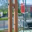 V-shape Net Large climbing net with wooden frame on playground.