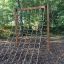 V-shape Net Large climbing net installed in an outdoor playground.