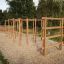 Step And Climb wooden ladder in an outdoor park setting.