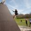 Climbing Ramp steel structure in use at a playground with children.